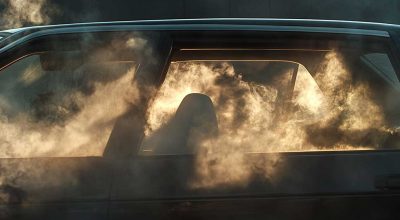 Realistic car interior with windows open, showing how to get weed smell out of car using coffee grounds, baking soda, and fresh air